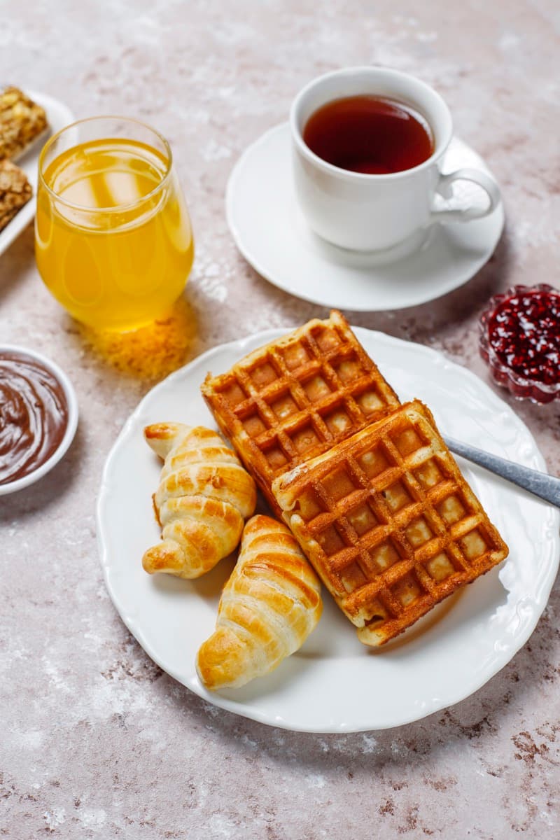 Fresh breakfast spread with coffee and waffles
